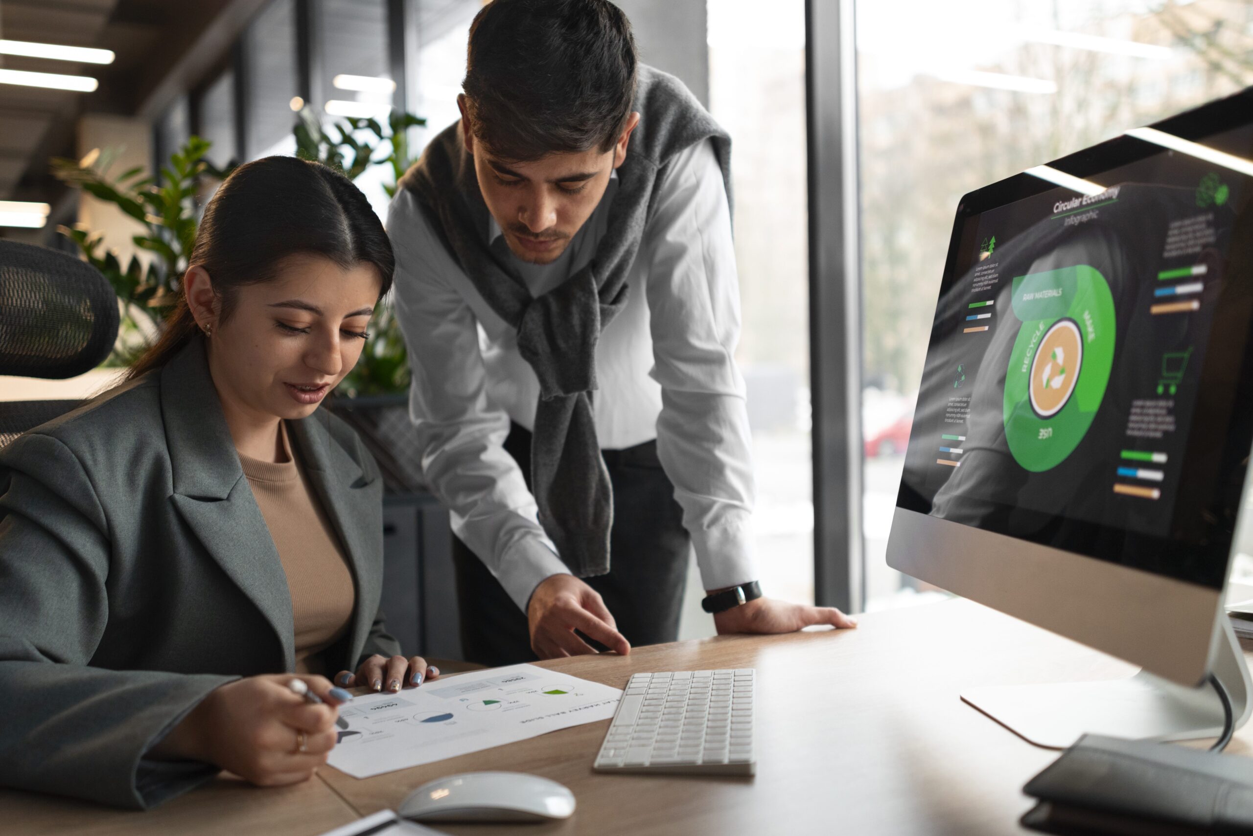 Collaborative Financial Planning Session – Obsidian, Your Trusted Financial Partner Financial partner reviewing strategic planning data with a business owner